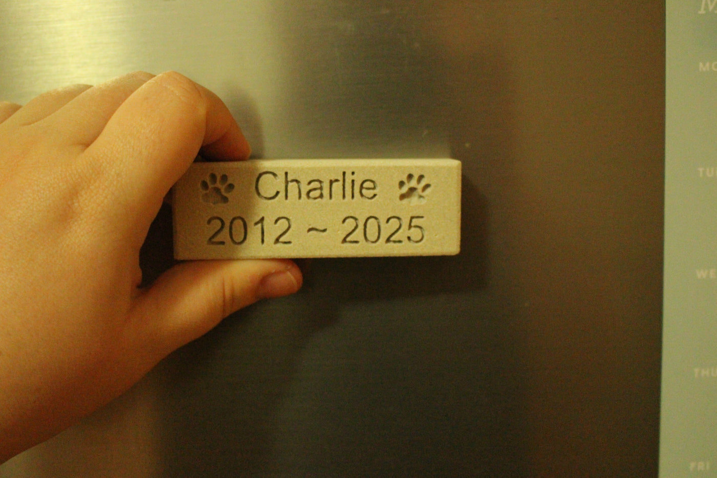 Engraved Sandstone Pet Memorial Fridge Magnet with "Charlie" and "2012-2025" enscribed.