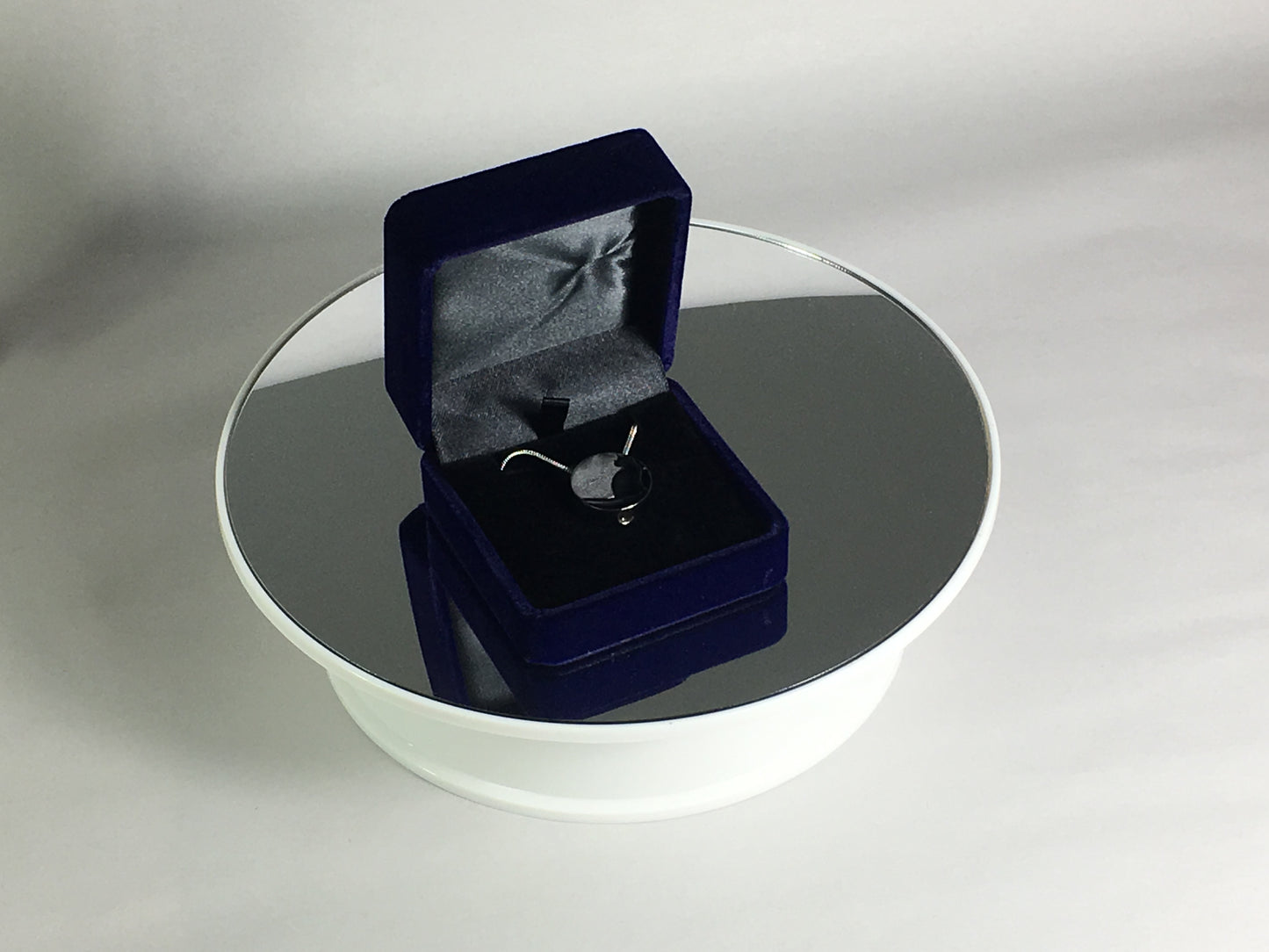 Cremation Jewellery Necklace with a black cat silhouette sitting in velvet case
