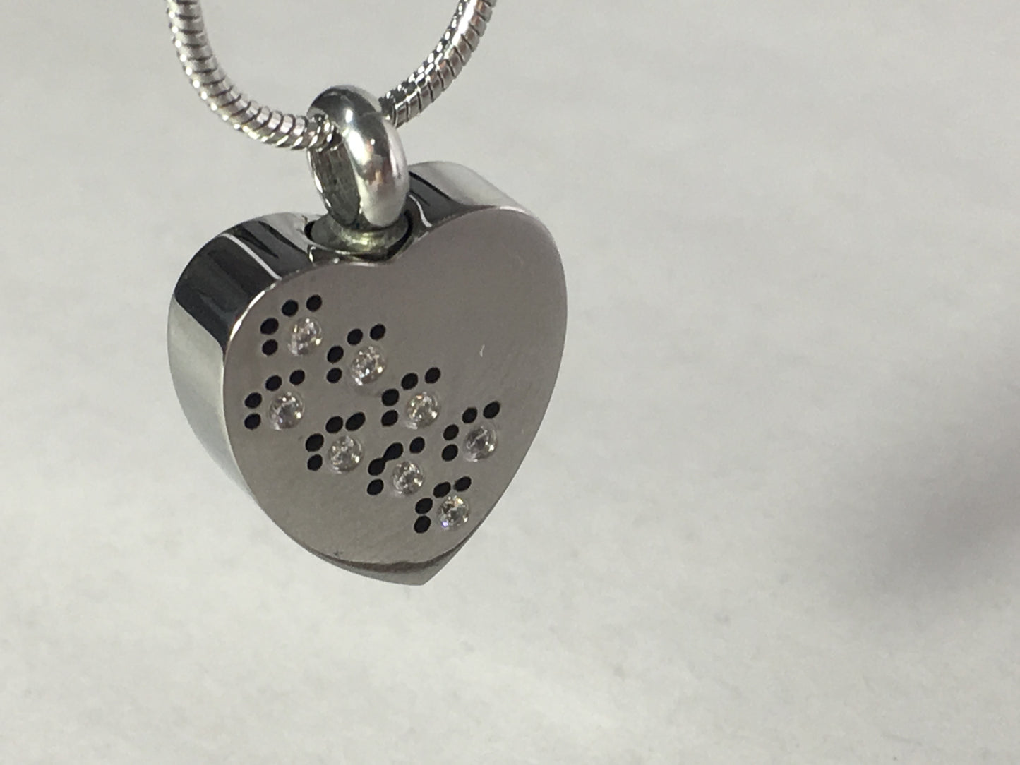Cremation Jewellery Necklace with a heart shaped pendant with diamante paw print design