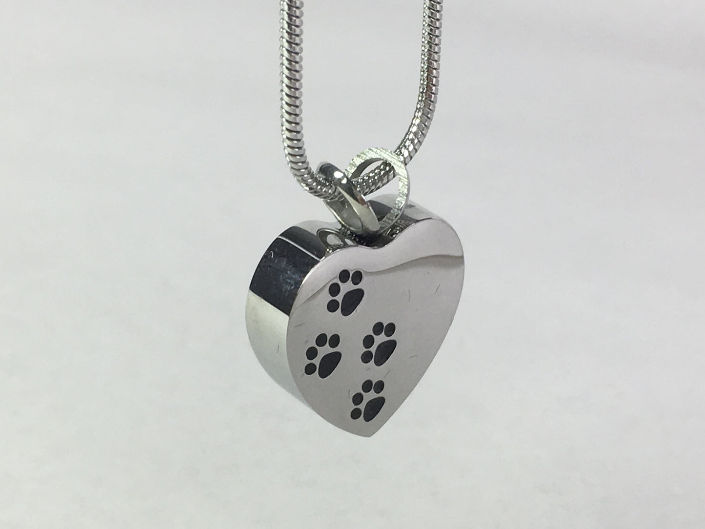 Cremation Jewellery Necklace with a Heart Pendant with Black paw print design across it