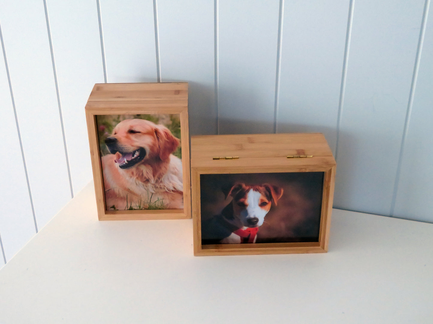 bamboo photo box urns with pictures on dogs one is standing vertical and the other horizontal