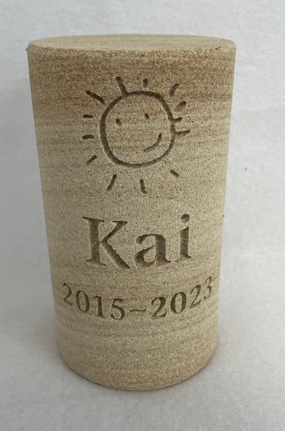 ENGRAVED SANDSTONE CYLINDER URN WITH A MEMORIAL INSCIPTION FOR A PERSON