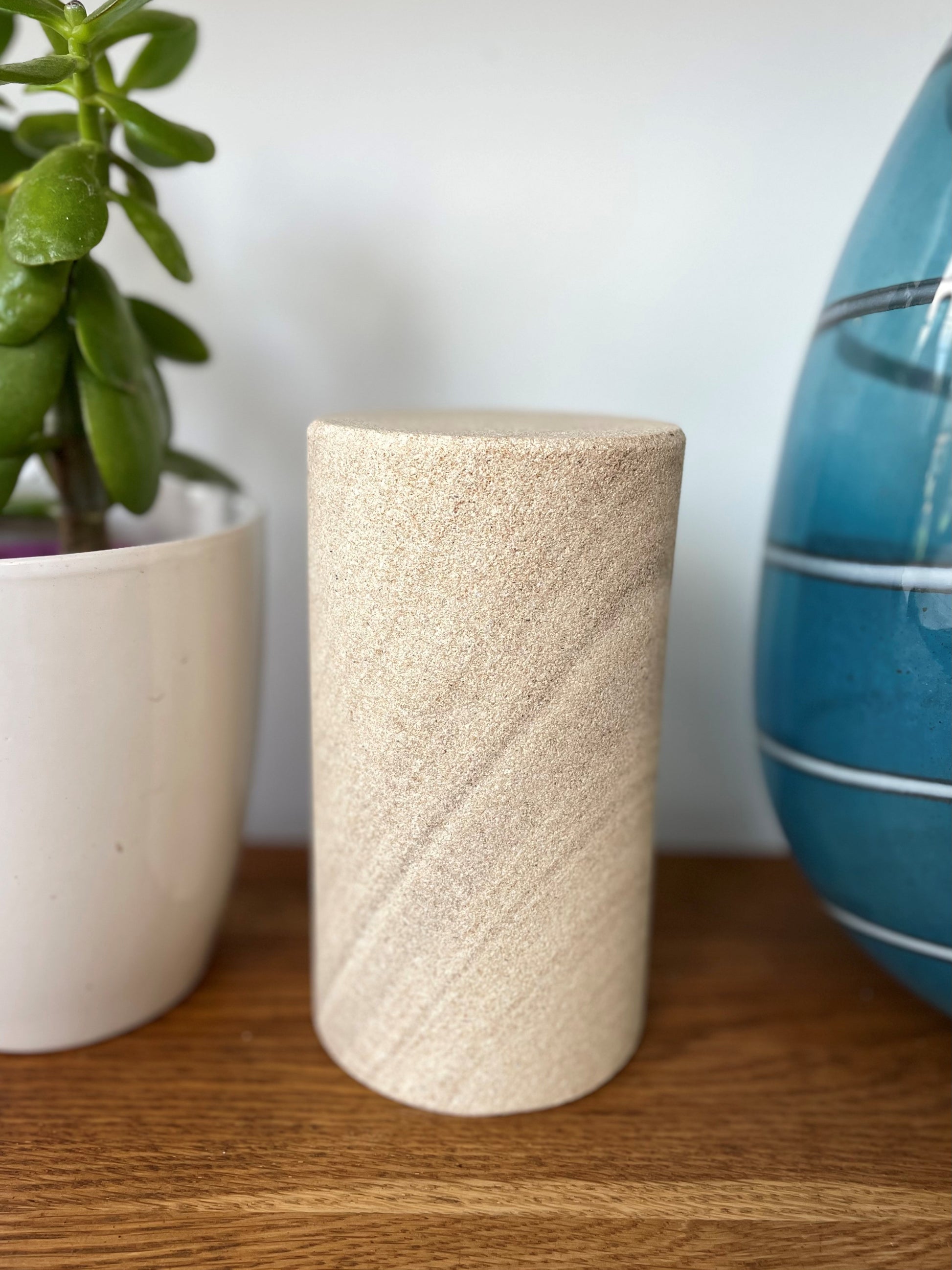 a blank staged sandstone cylinder urn