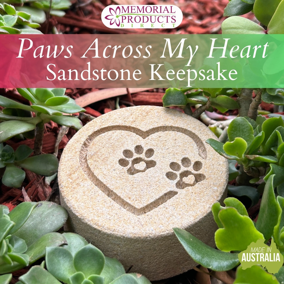 sandstone keepsake engraved with a love heart that has paws across it